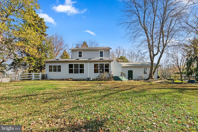 back of house featuring a yard