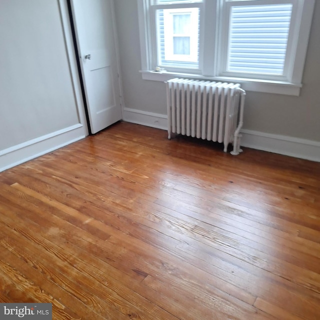 interior space with light hardwood / wood-style flooring and radiator