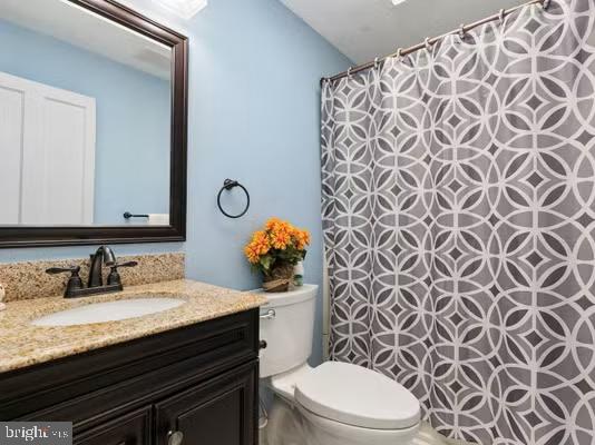 bathroom with vanity and toilet