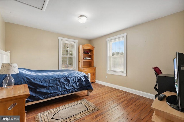 bedroom with wood-type flooring