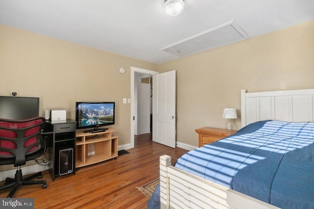 bedroom with hardwood / wood-style flooring