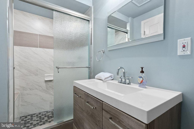 bathroom with vanity and an enclosed shower