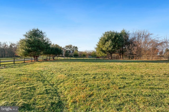 view of yard with a rural view