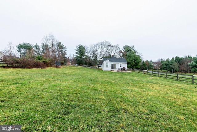 view of yard with a rural view