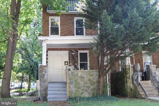 view of front of home with a balcony