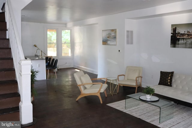 living room with dark hardwood / wood-style flooring