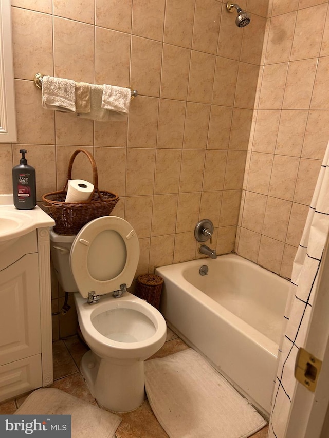 full bathroom featuring vanity, shower / bath combination with curtain, toilet, tile walls, and tasteful backsplash