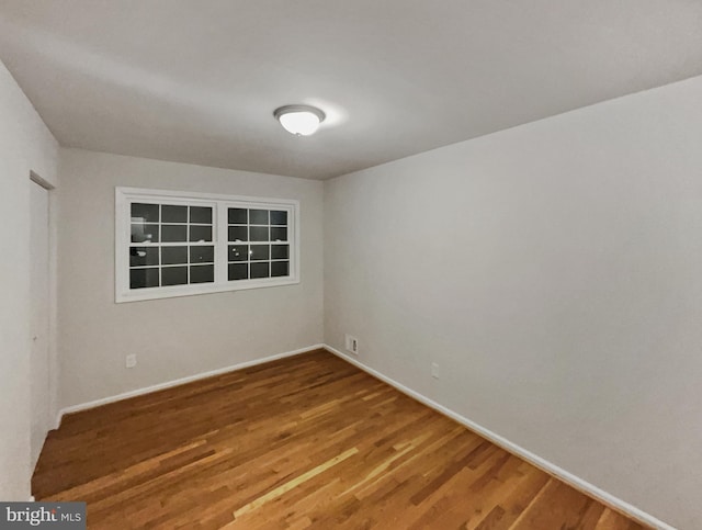 empty room featuring hardwood / wood-style floors