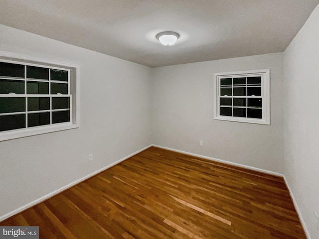 empty room featuring dark hardwood / wood-style floors