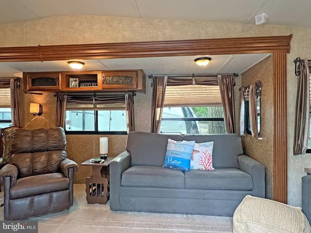 living room with lofted ceiling