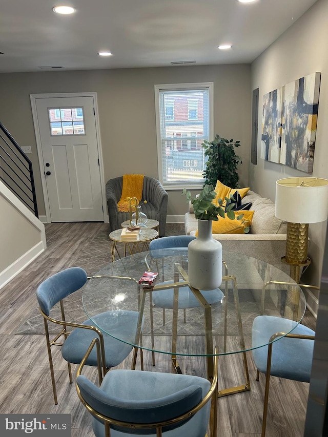 living room featuring hardwood / wood-style floors and a healthy amount of sunlight