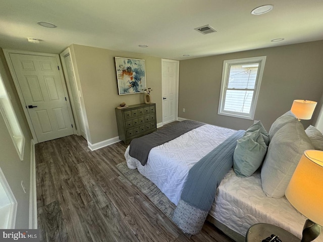 bedroom featuring dark hardwood / wood-style floors