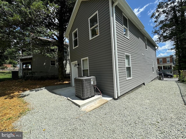 view of side of home featuring central air condition unit