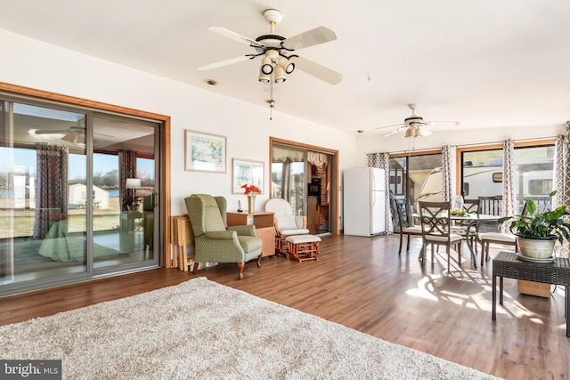 interior space with ceiling fan and hardwood / wood-style floors