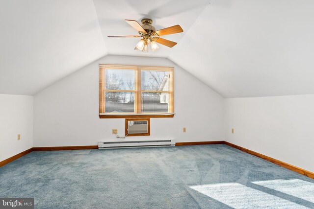 additional living space featuring ceiling fan, baseboard heating, a wall unit AC, vaulted ceiling, and carpet