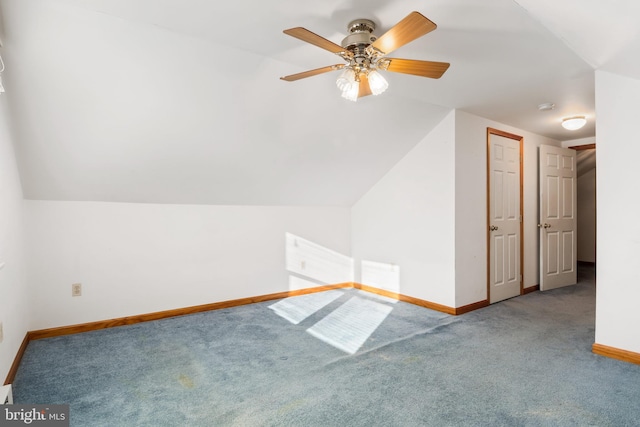 additional living space with carpet floors, vaulted ceiling, and ceiling fan