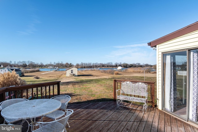 wooden deck with a lawn