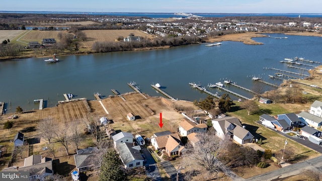 birds eye view of property featuring a water view