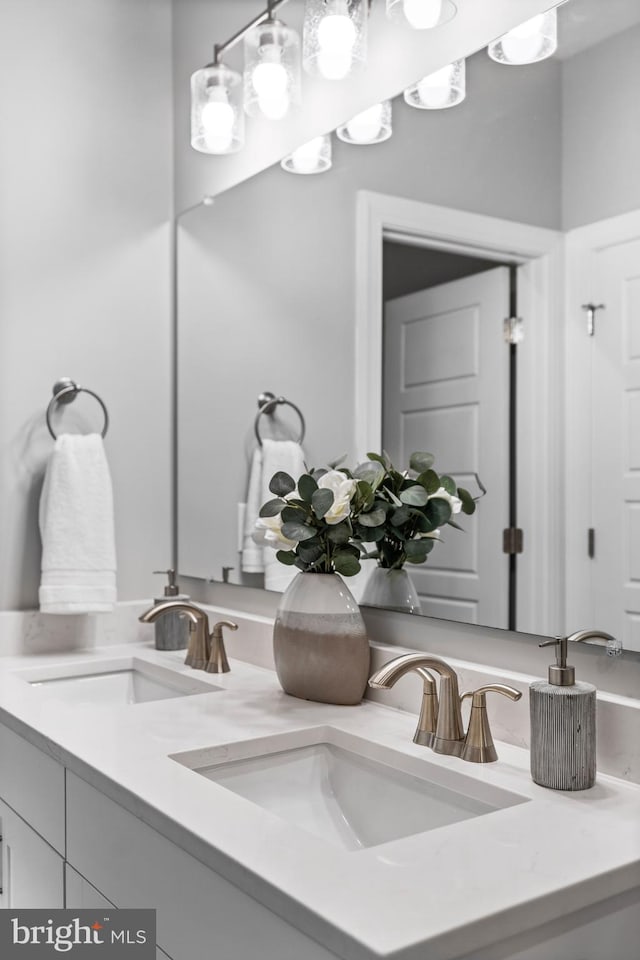 bathroom featuring double vanity and a sink