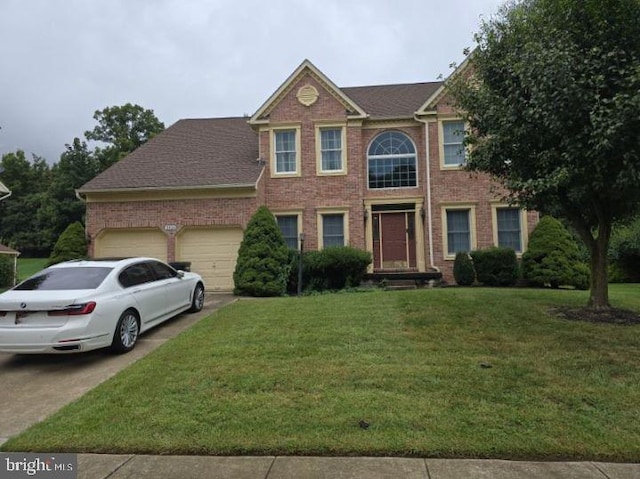 view of front of house with driveway, a front lawn, an attached garage, and brick siding