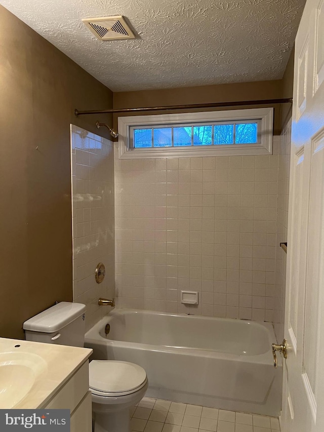 full bathroom with shower / bath combination, visible vents, toilet, vanity, and tile patterned flooring