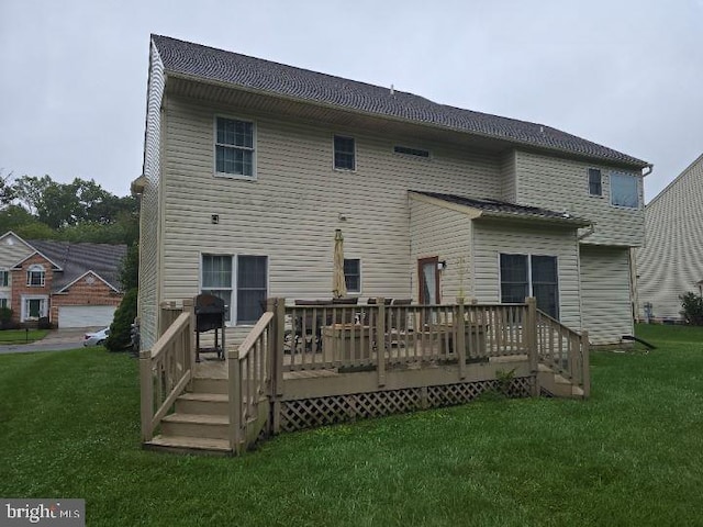 back of property featuring a deck and a yard