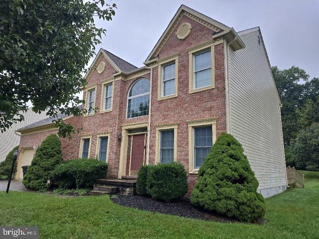 view of front of house with a front lawn and brick siding