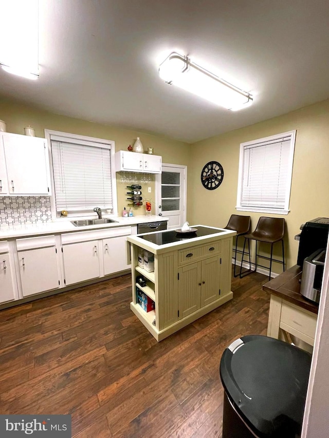 kitchen with dark hardwood / wood-style flooring, white cabinetry, green cabinets, and sink