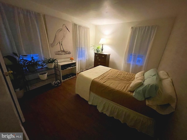 bedroom featuring dark hardwood / wood-style floors