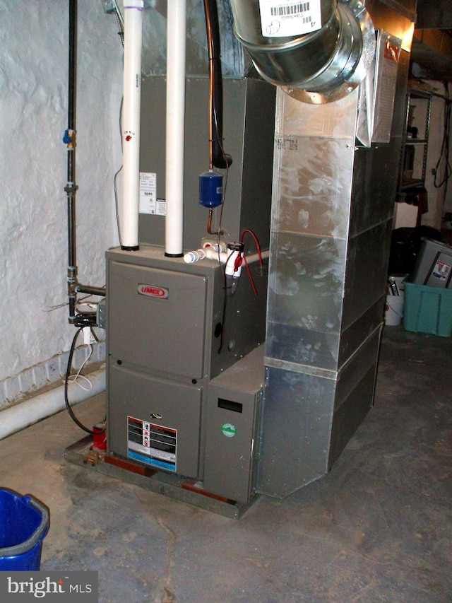 utility room with heating unit