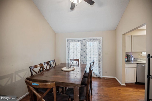 dining area with hardwood / wood-style flooring, ceiling fan, and lofted ceiling