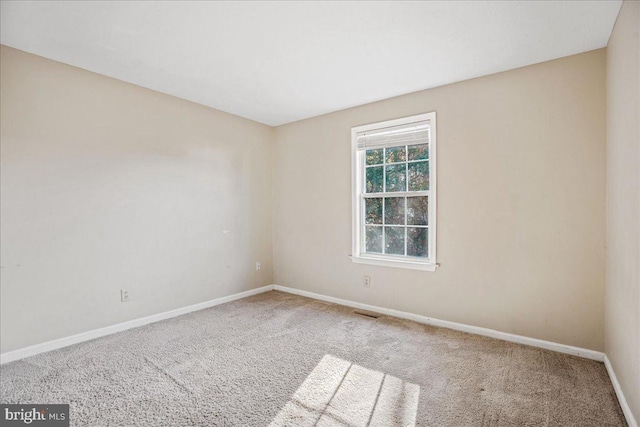 empty room with carpet flooring