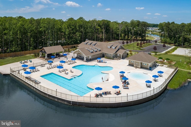 view of pool featuring a water view