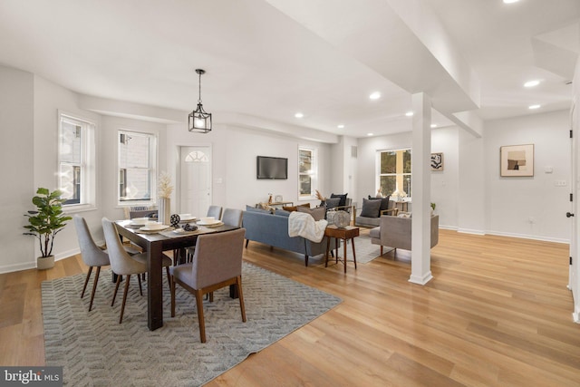 dining space featuring light wood-type flooring