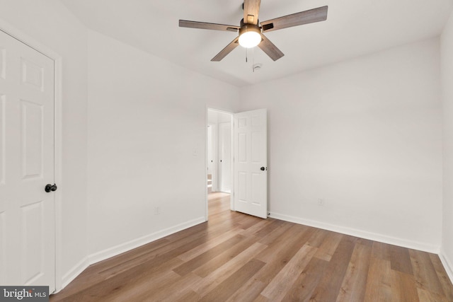 empty room featuring light hardwood / wood-style flooring and ceiling fan