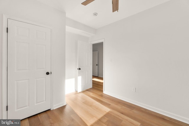 unfurnished bedroom featuring light hardwood / wood-style floors and ceiling fan