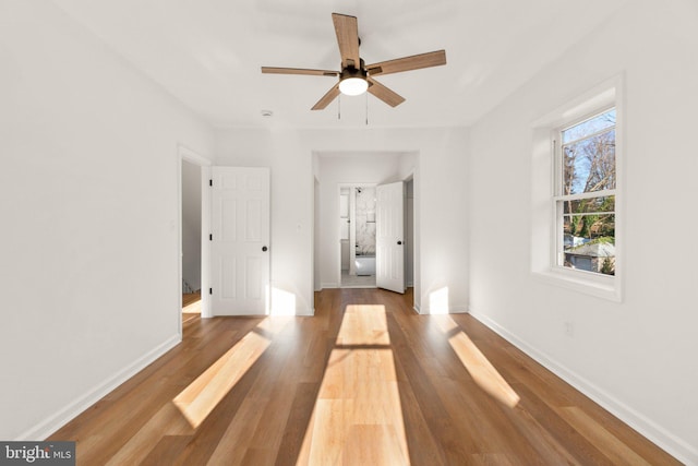 unfurnished room featuring ceiling fan and hardwood / wood-style flooring