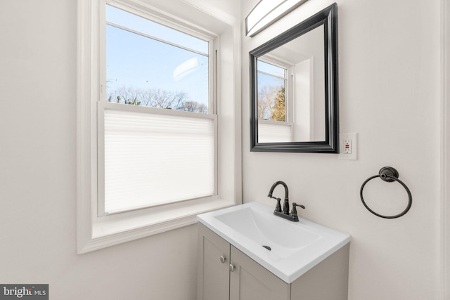 bathroom featuring a wealth of natural light and vanity