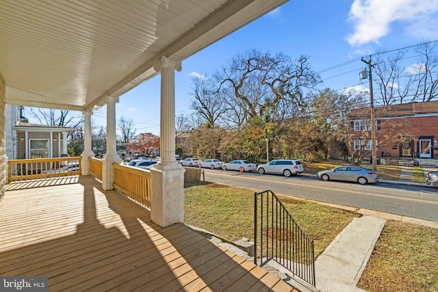 wooden terrace featuring covered porch