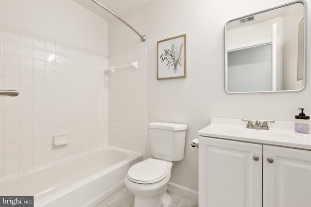 full bathroom featuring toilet, vanity, and tiled shower / bath