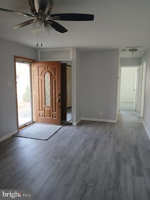 entryway with hardwood / wood-style flooring and ceiling fan