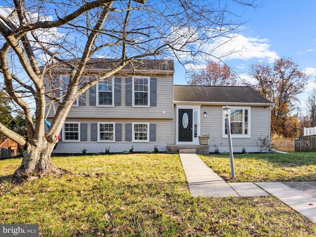 split level home featuring a front yard