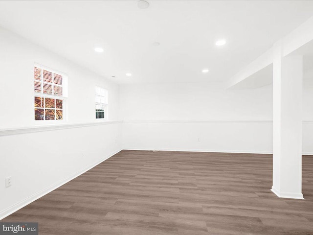 unfurnished room featuring dark hardwood / wood-style flooring