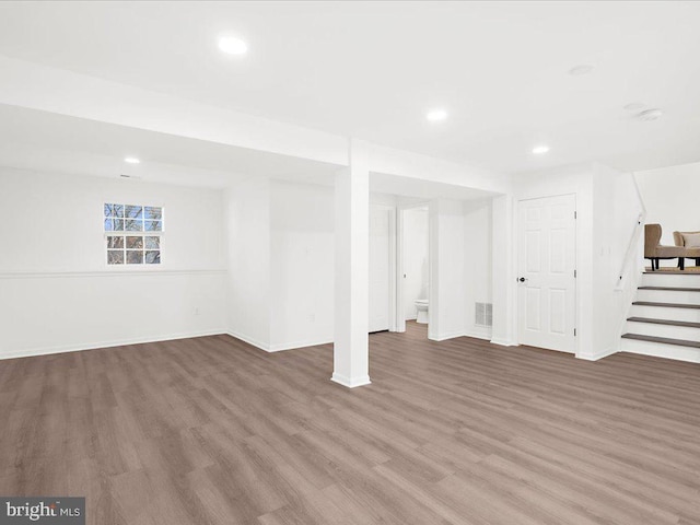 basement featuring hardwood / wood-style floors