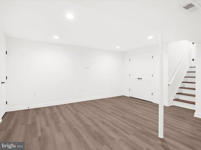 basement with dark wood-type flooring