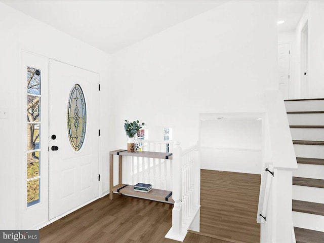 foyer entrance featuring dark hardwood / wood-style floors