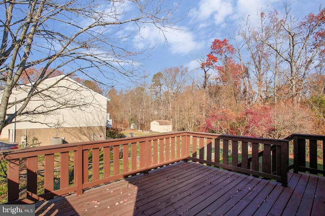 wooden terrace with a storage unit