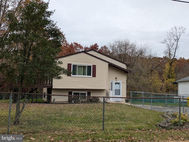 view of property exterior with a lawn