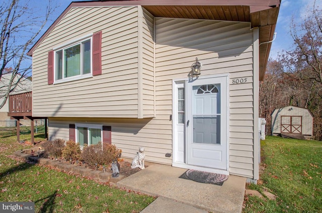 doorway to property with a yard