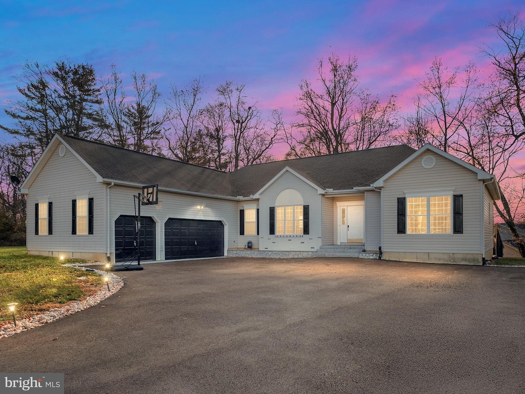 ranch-style home featuring a garage